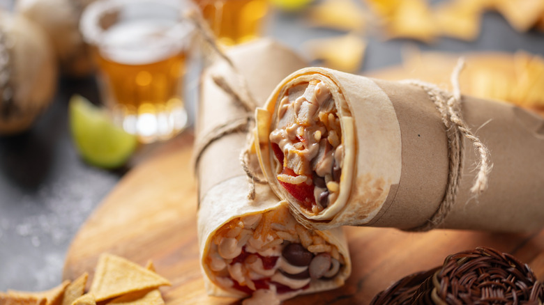 A generic chicken burrito cut in half
