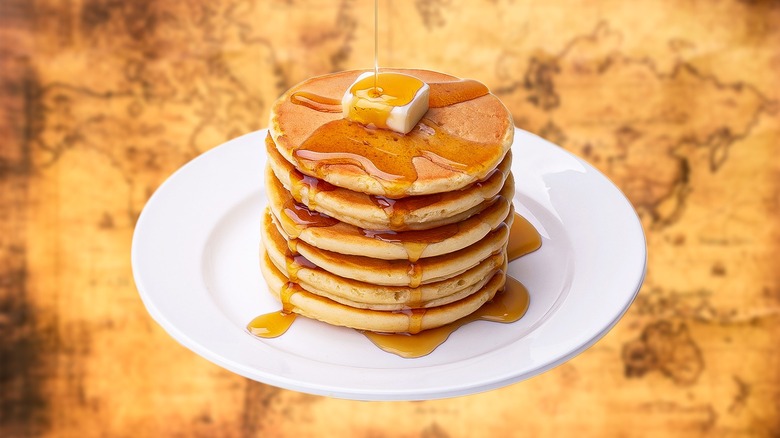 maple syrup pouring over pancakes
