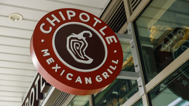 A Chipotle sign is outside one of its restaurants
