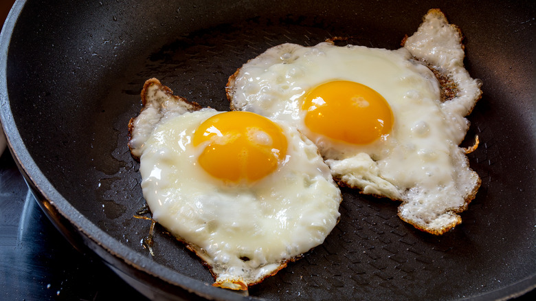 frying eggs in a pan