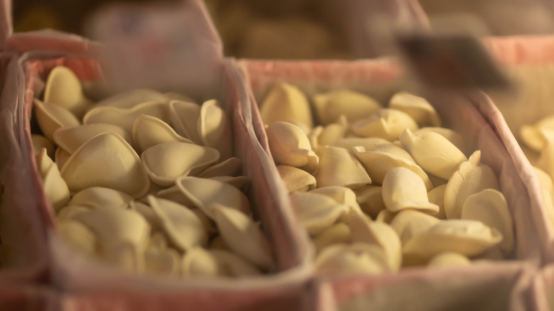 Pierogie being placed in freezer 