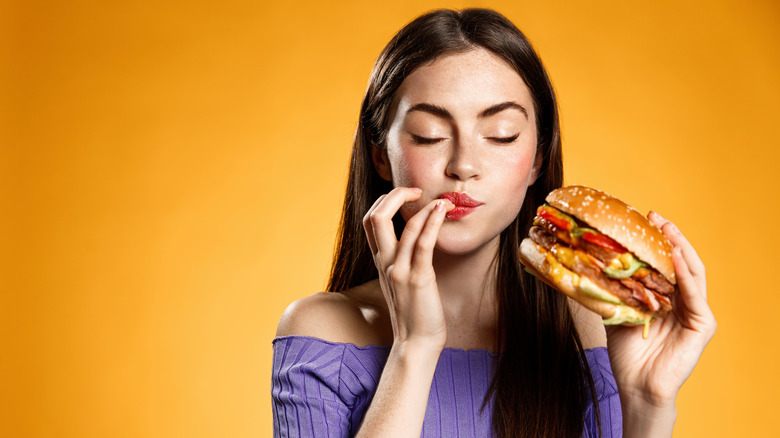Woman eating burger
