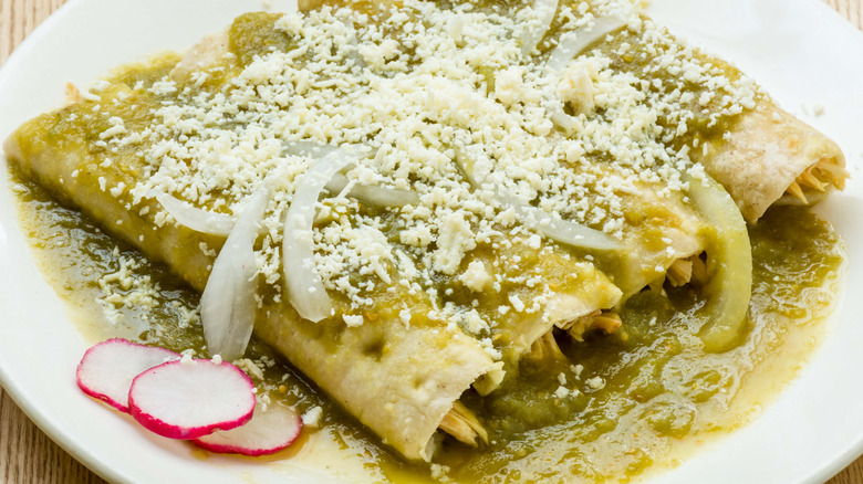 enchiladas topped with tomatillo sauce