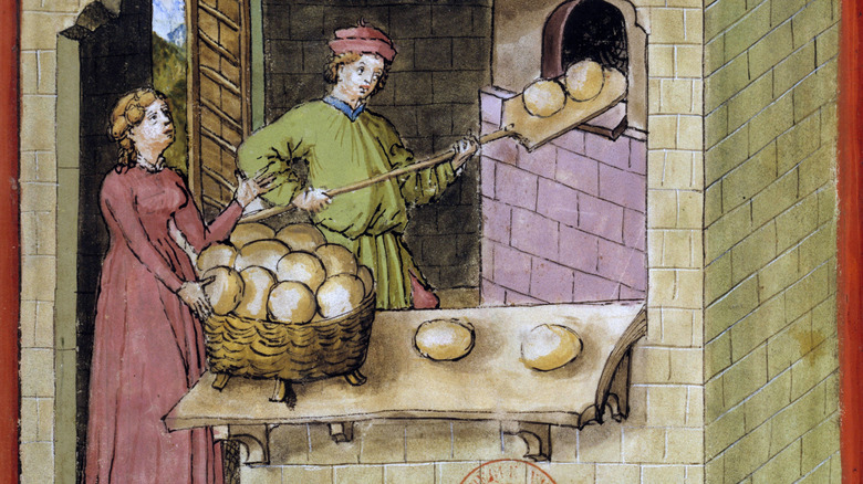 Illustration of medieval bakers taking bread out of an oven