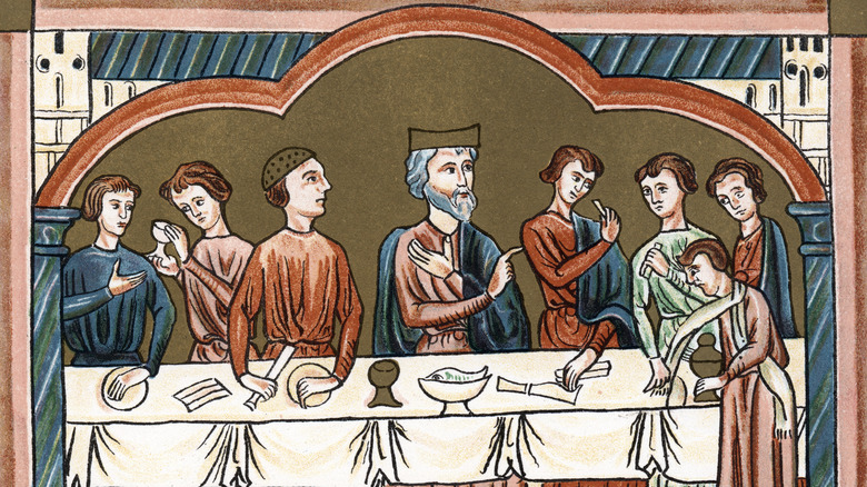 Medieval illustration of a Plantagenet king and court at dining table