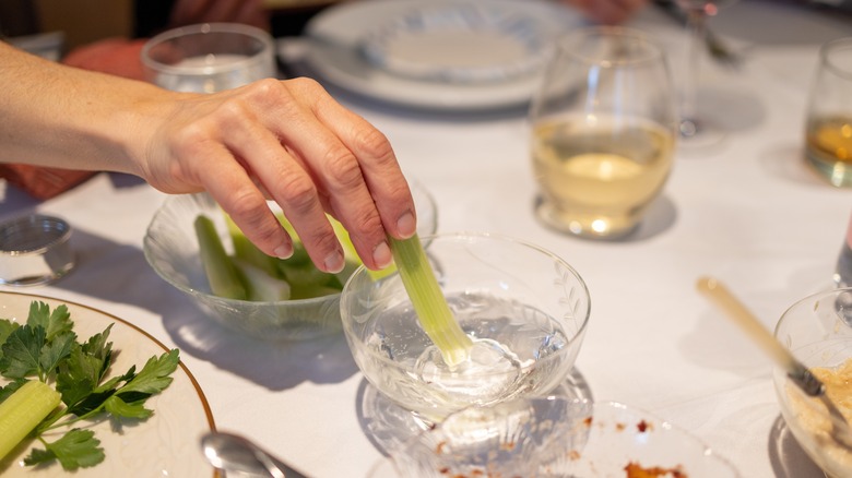 Dipping karpas in salt water