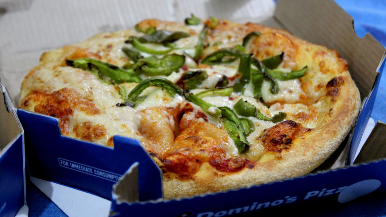 cardboard box holding Domino's pizza