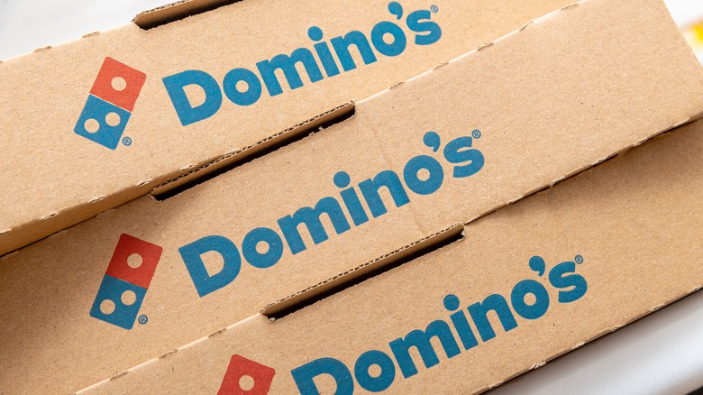 pizza boxes bearing Domino's name