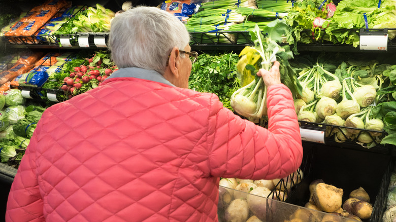 person shopping for kohlrabi