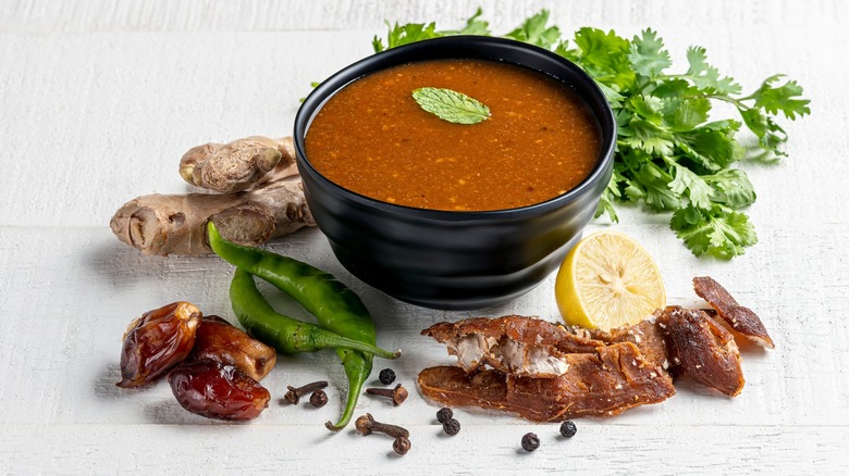 Small bowl of tamarind chutney with spices