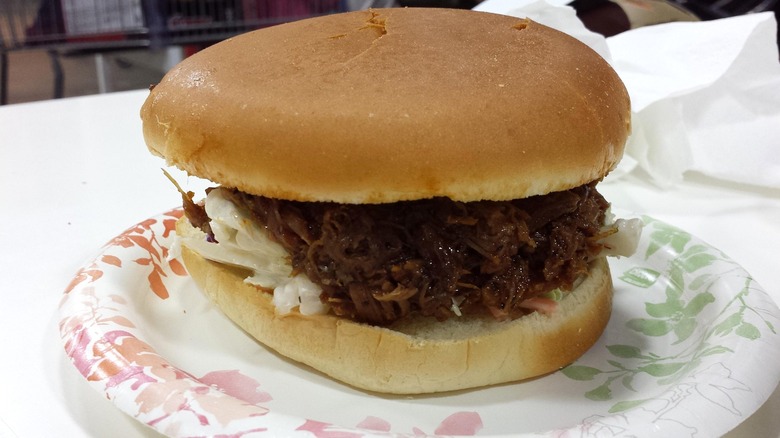 Costco BBQ beef brisket sandwich on paper plate