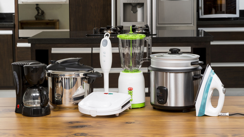 An assortment of small household appliances on a kitchen counter