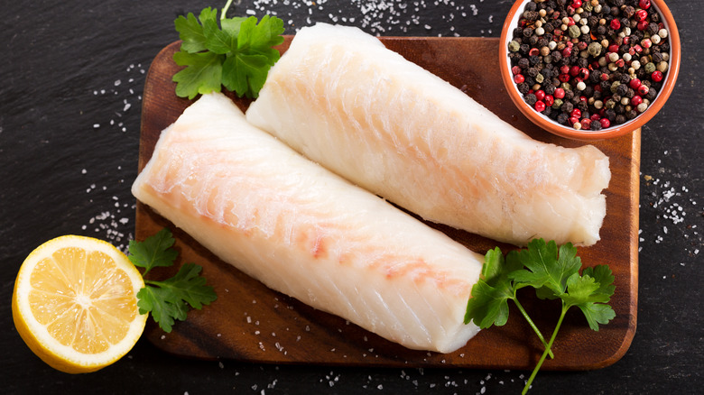 Cod filets on cutting board