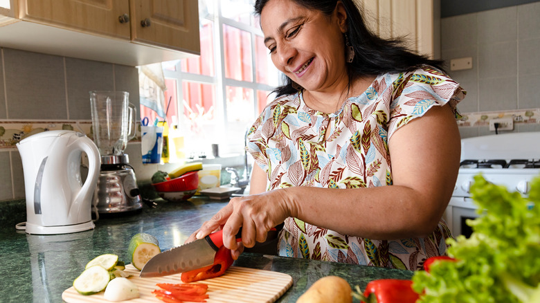 Person cutting vegetables