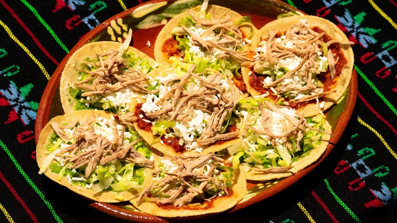 Several chalupas on a tray