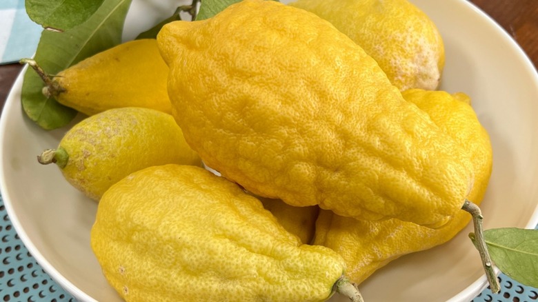 citron fruits in a white bowl