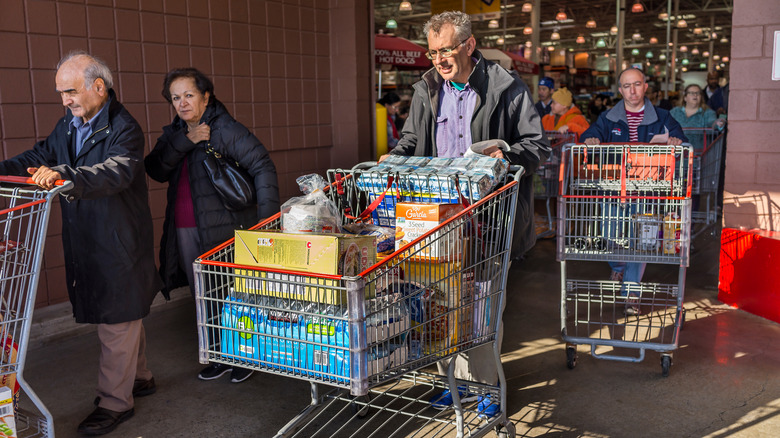 Shoppers with carts exit Costco