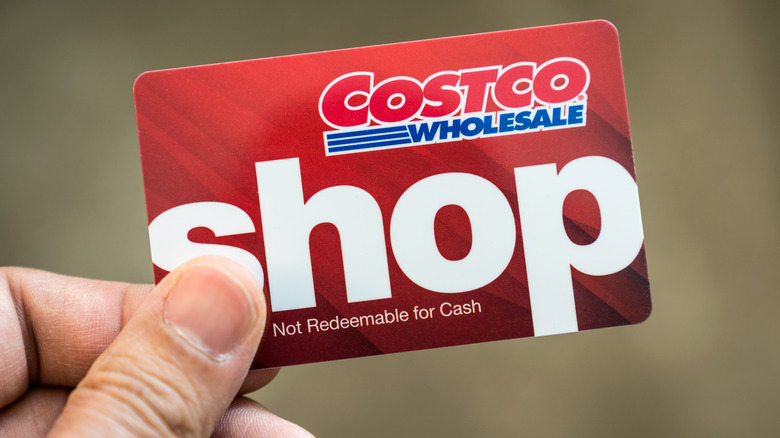 A person holds a Costco shop card