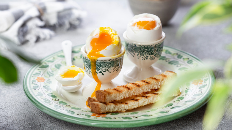 two soft boiled eggs with runny yolks