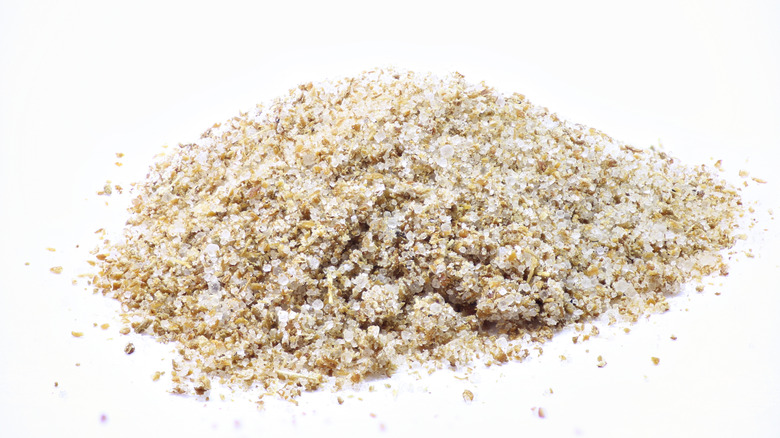 Pile of celery salt on a white surface