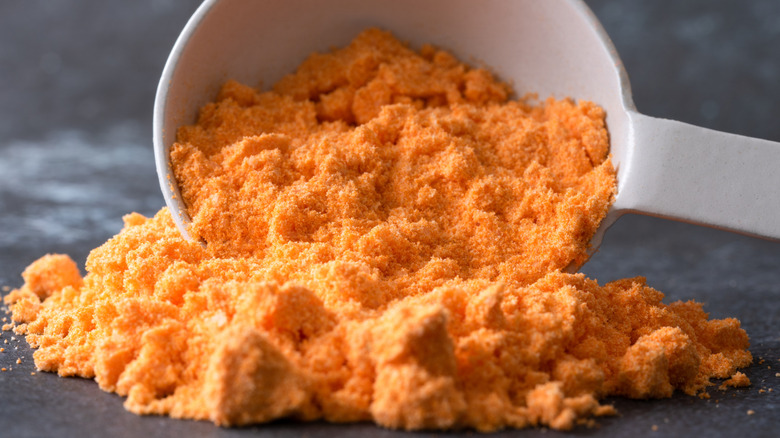 Spoon of cheese powder