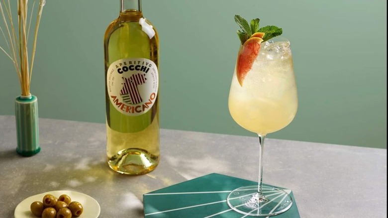 Bottle of cocchi americano and cocktail 