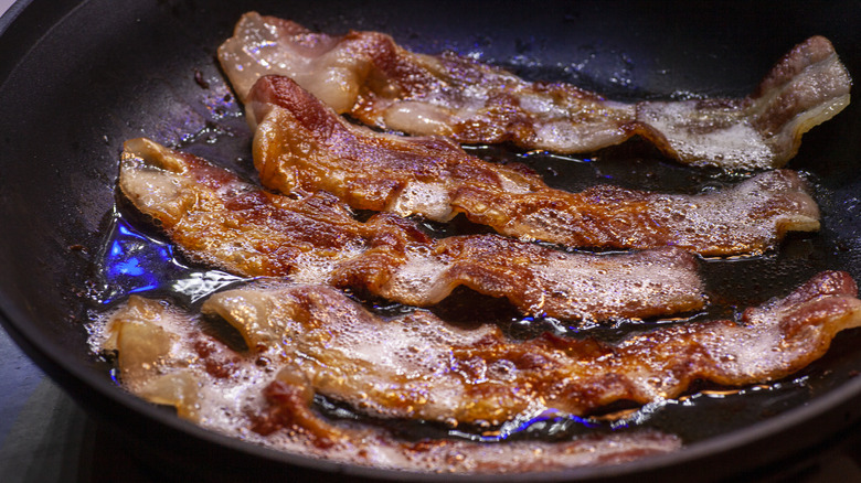 bacon frying in pan