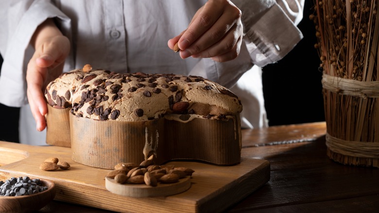 person making chocolate chip colomba