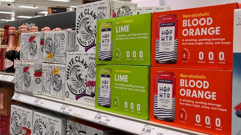 Hop WTR on store shelf next to White Claw