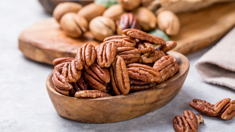 Wooden bowl of fresh pecans