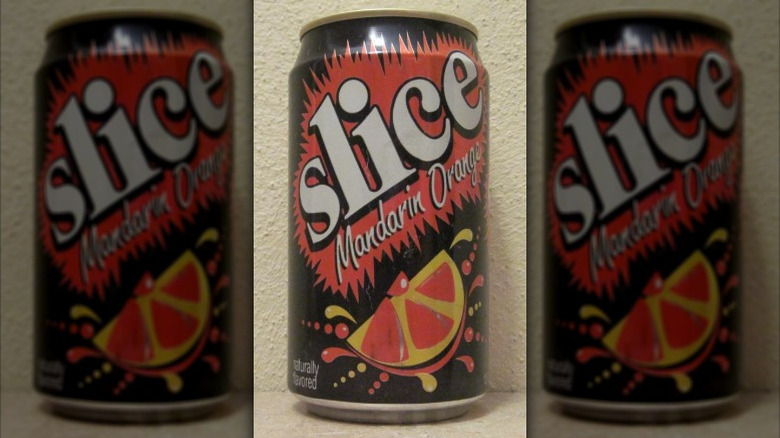 A can of vintage Slice mandarin orange on a neutral background