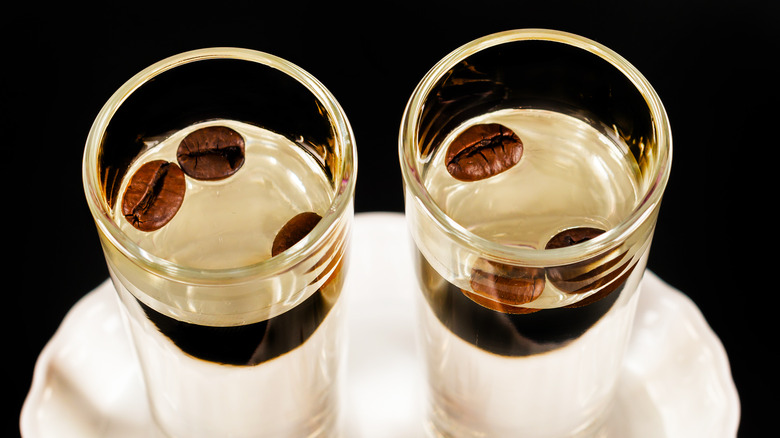 Sambuca glasses with three coffee beans