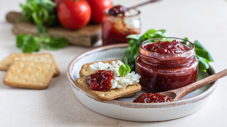 Tomato jam on crackers on plate