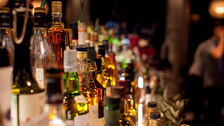 Liquor bottles on shelves at bar
