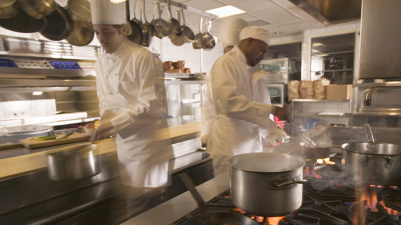 chefs working in a restaurant kitchen