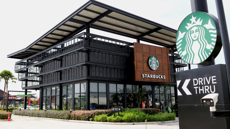 Starbucks store outside view with drive-thru sign