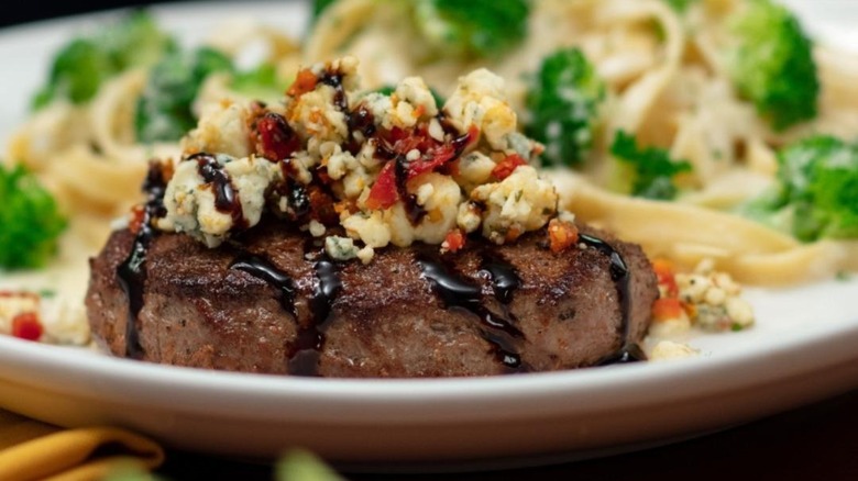 steak topped with gorgonzola cheese