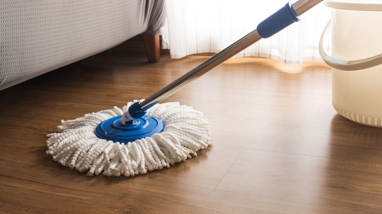 Mop on wooden floor.