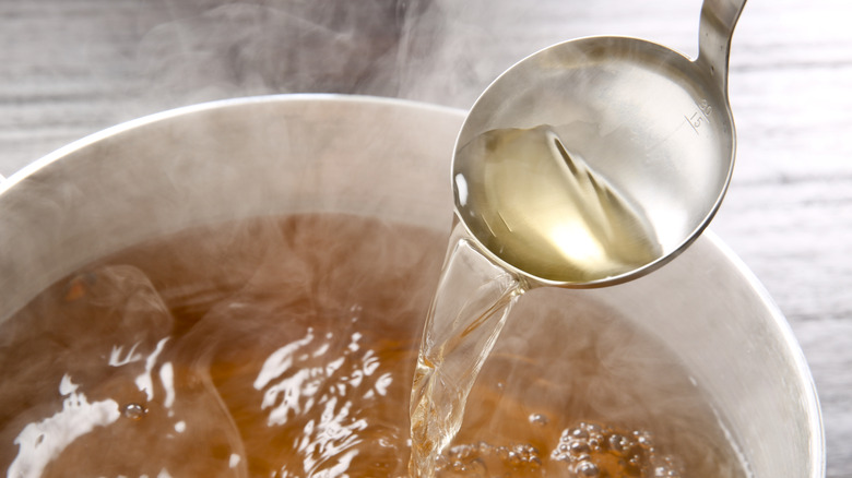 Ladle with a bowl of dashi