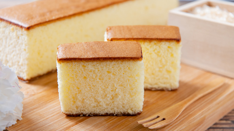 Japanese castella cake on a wooden cutting board