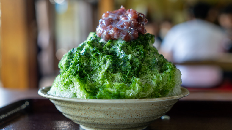 Green kakigori topped with red bean