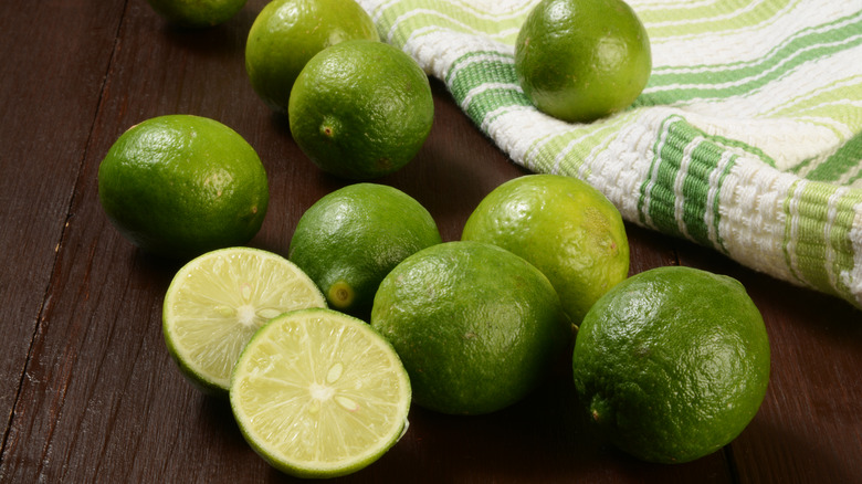 Key limes on wooden table