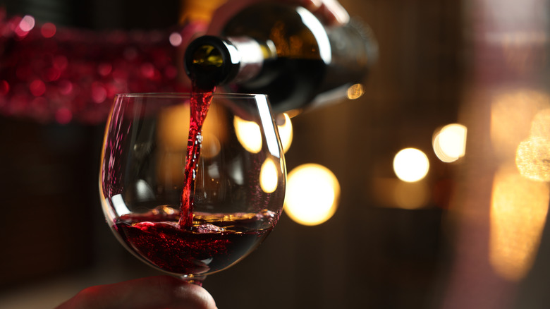 Red wine being poured into a glass