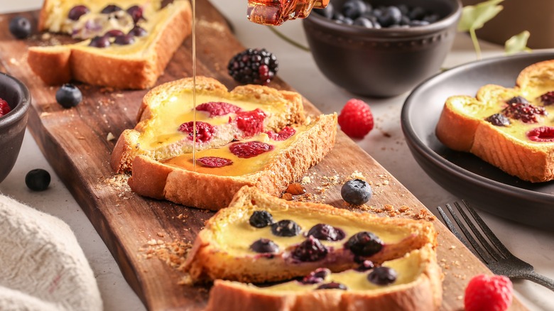 Yogurt toast with berries and honey drizzling