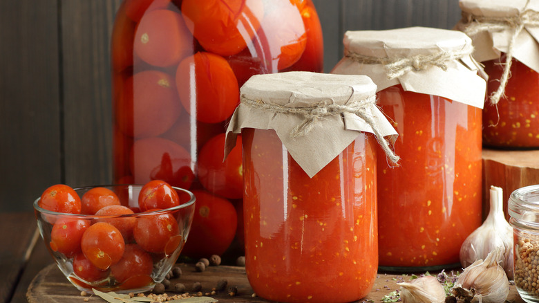 Glass jars of homemade tomato products
