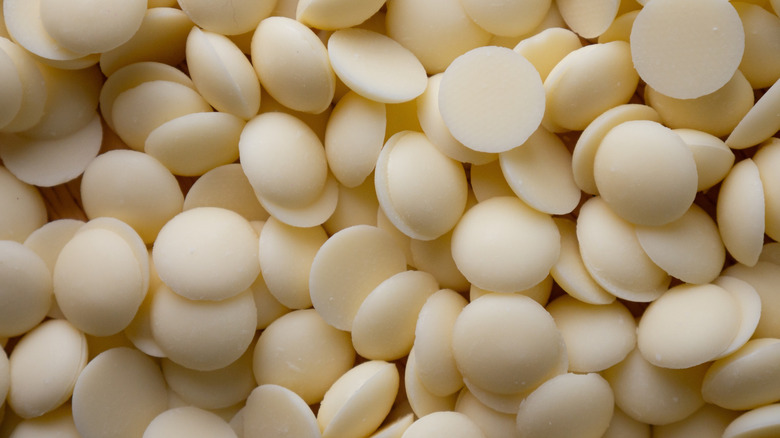 A close-up of white chocolate candy melts filling the frame