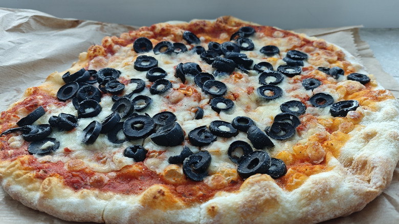 Cheese pizza topped with black olives