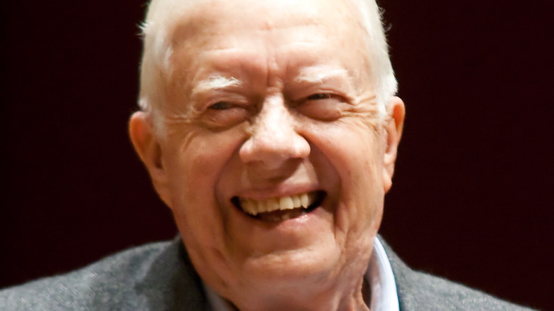 Jimmy Carter smiling on stage