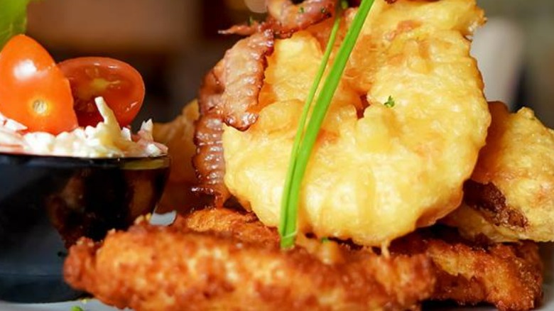 Chicken Maryland topped with bacon and bananas