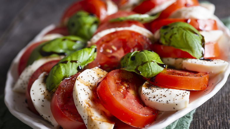Tomato salad with cheese and basil 